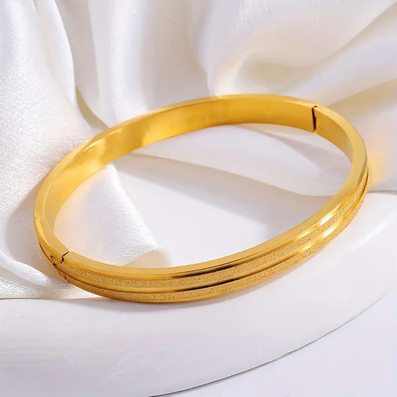 A Pair Of Stainless Steel Matte Bracelets
