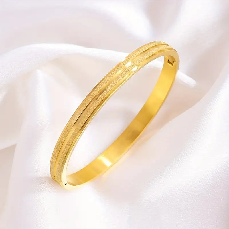 A Pair Of Stainless Steel Matte Bracelets