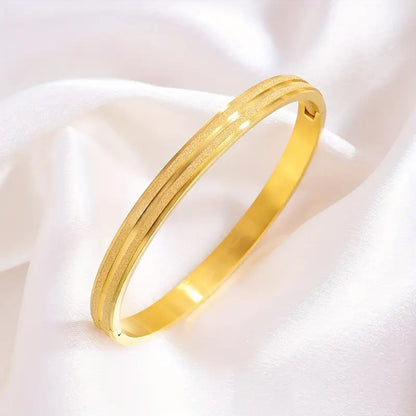 A Pair Of Stainless Steel Matte Bracelets