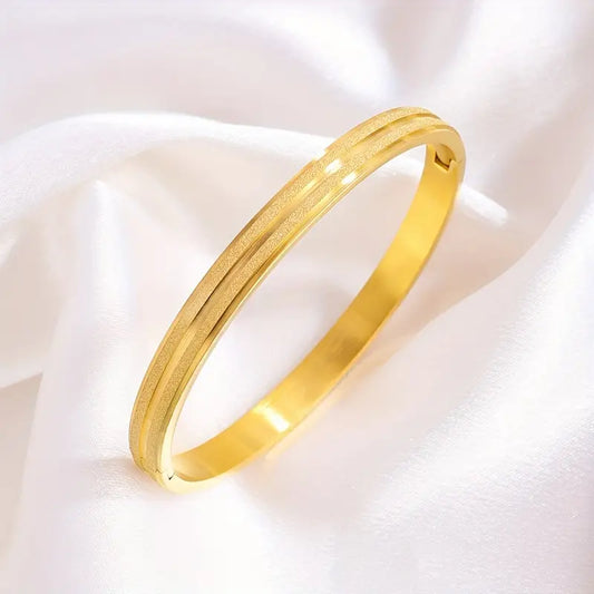 A Pair Of Stainless Steel Matte Bracelets