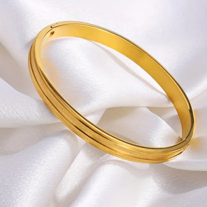A Pair Of Stainless Steel Matte Bracelets