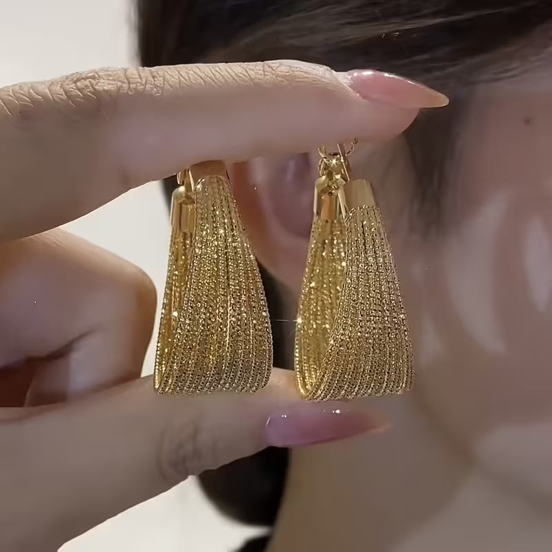 A Pair of Vintage-Style Women'S Earrings with a Geometric Iron Texture