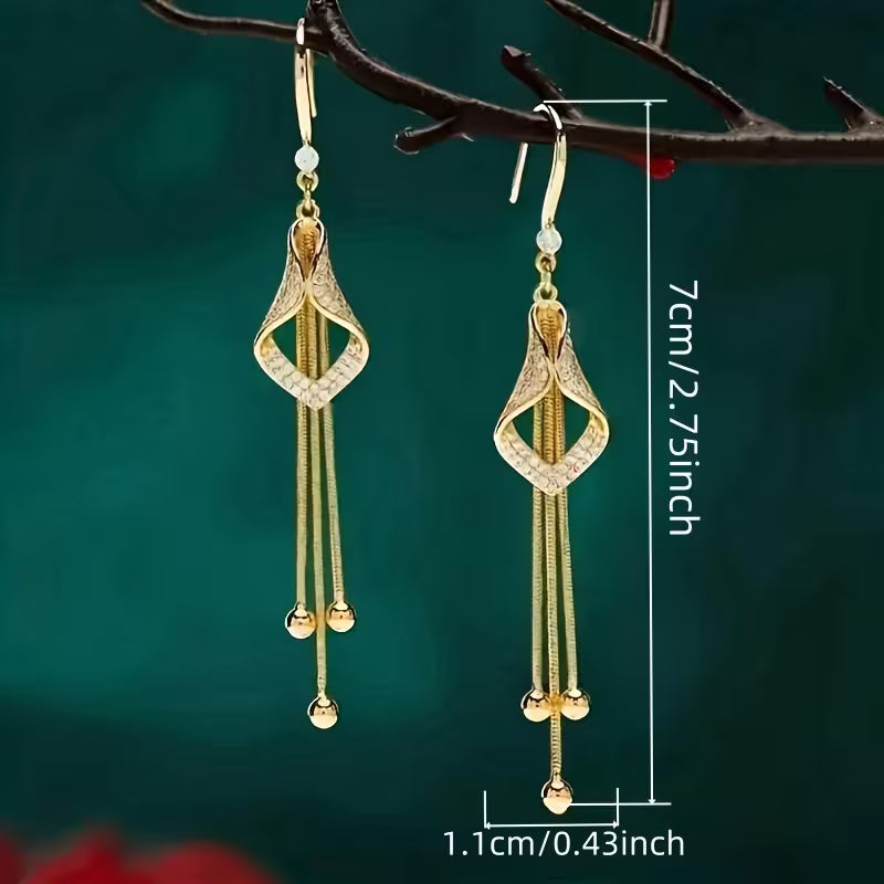 A Set of Stylish And Opulent Women'S Earrings Designed Like Golden Tassel Skirts