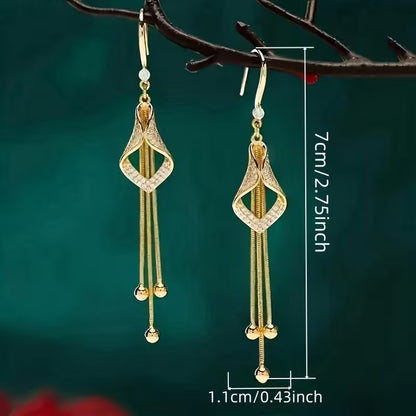 A Set of Stylish And Opulent Women'S Earrings Designed Like Golden Tassel Skirts