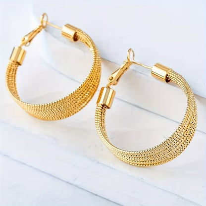 A Pair of Vintage-Style Women'S Earrings with a Geometric Iron Texture