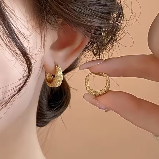 A Pair of Minimalist And Stylish Round Earrings in Matte Golden