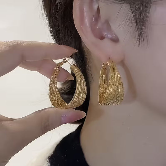 A Pair of Vintage-Style Women'S Earrings with a Geometric Iron Texture