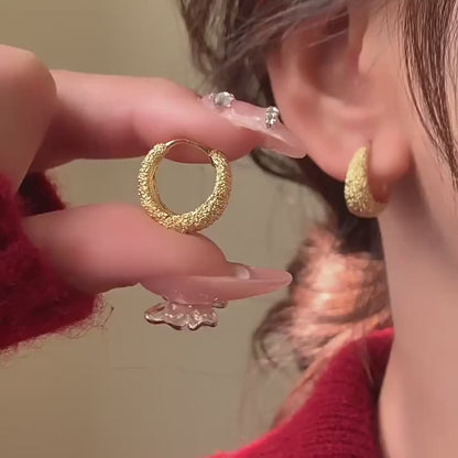 A Pair of Minimalist And Stylish Round Earrings in Matte Golden