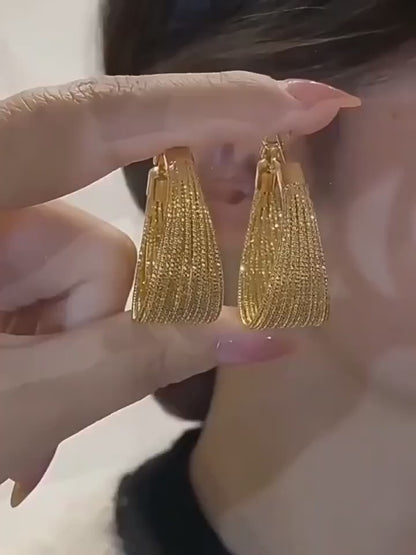 A Pair of Vintage-Style Women'S Earrings with a Geometric Iron Texture